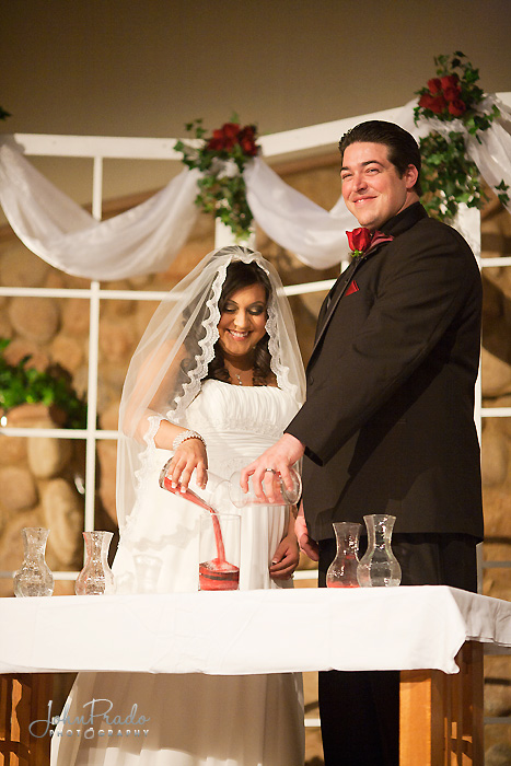 Bride & Groom pictured on the altar during sand ceremony photo