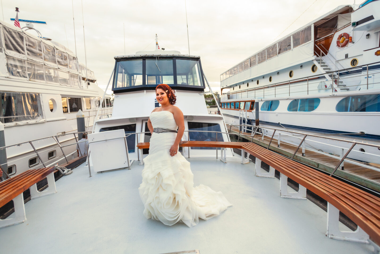 Bride posing on deck of Horn Blower Cruises