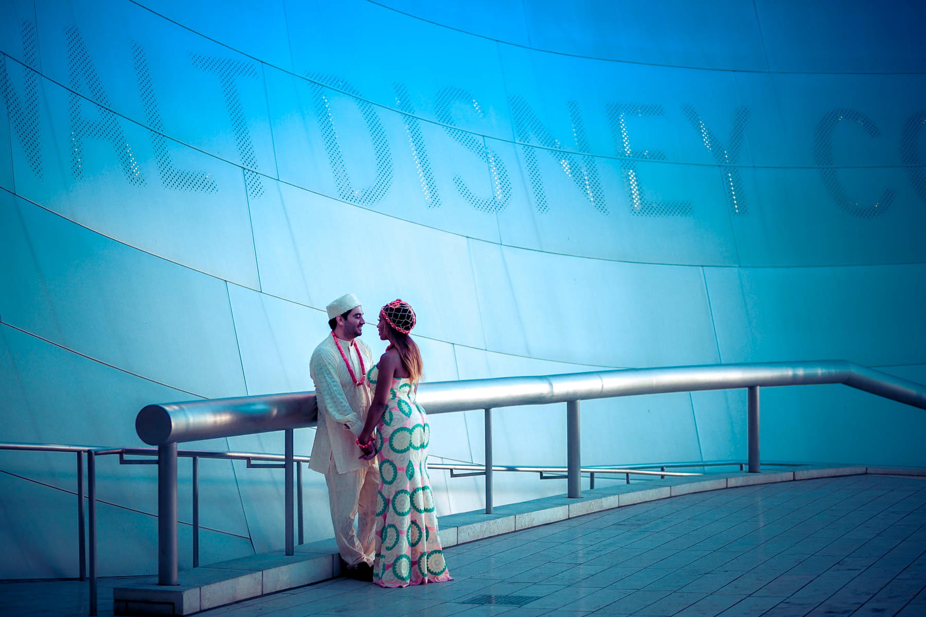 wedding couple Romanticly draped in blue colors at Disney Hall 
