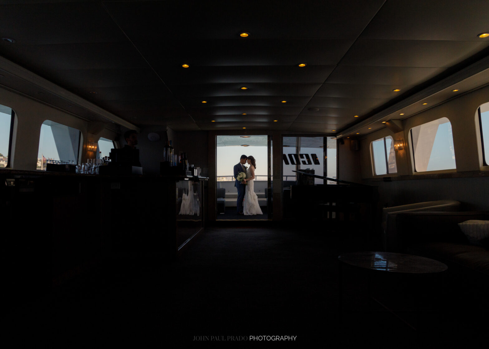 Bride and groom enjoying a Newport Beach city cruise wedding