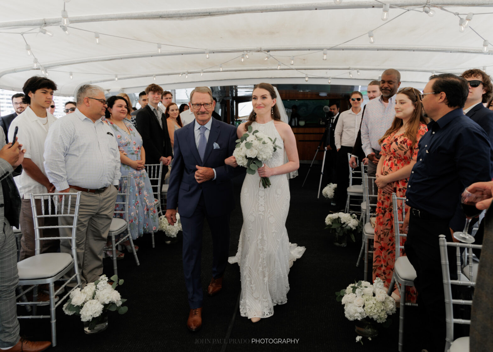 Father of the bride walking own the aisle