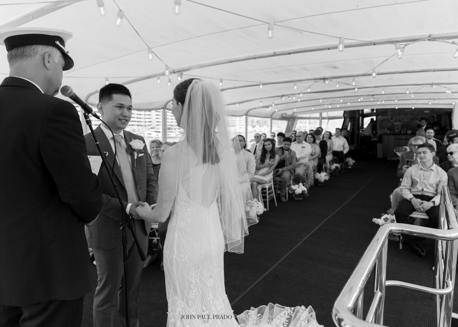 Bride and groom sailing into sunset during Newport Beach wedding