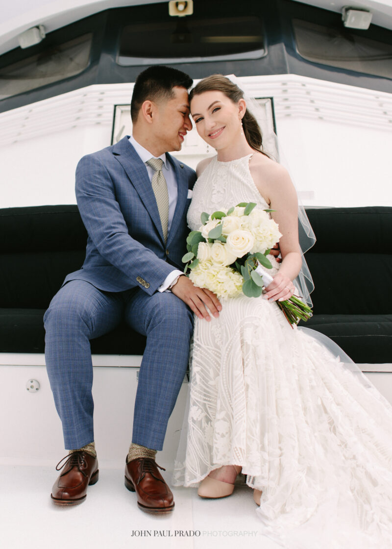 Newlywed portraits on a Newport Beach city cruise