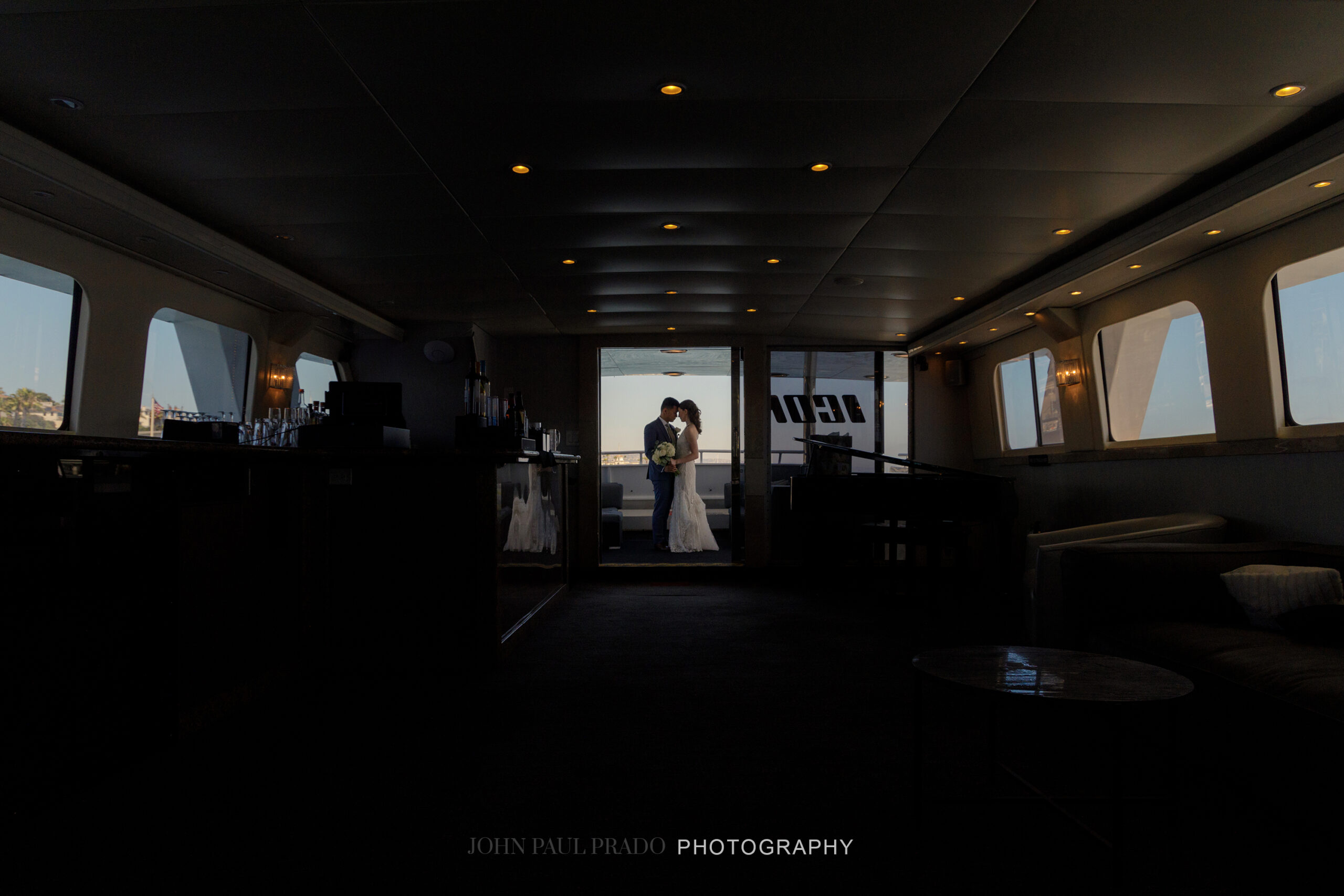 Bride and groom enjoying a Newport Beach city cruise wedding